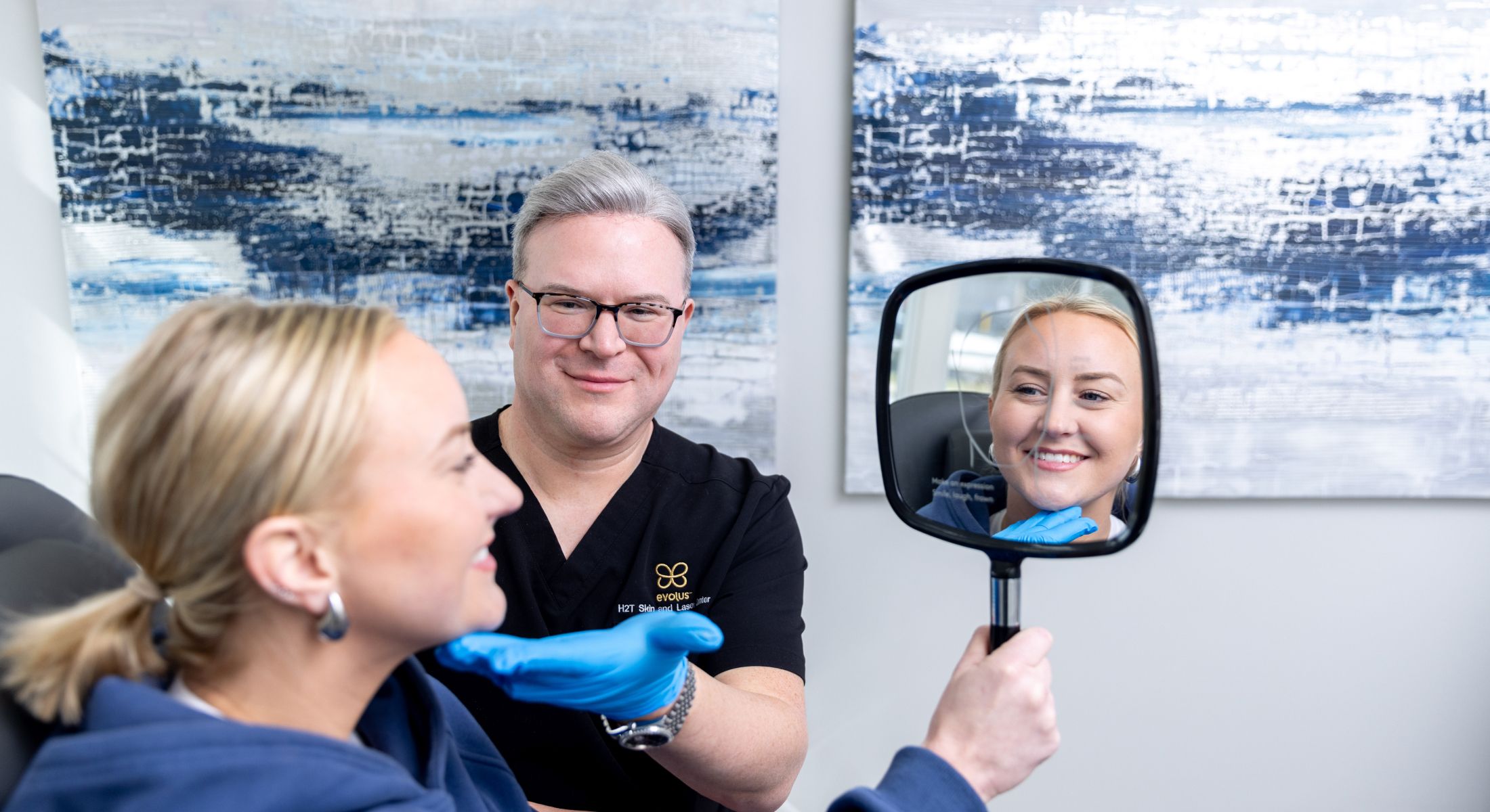 Matt Azulay-LaFever with a student and a patient model sitting in the chair